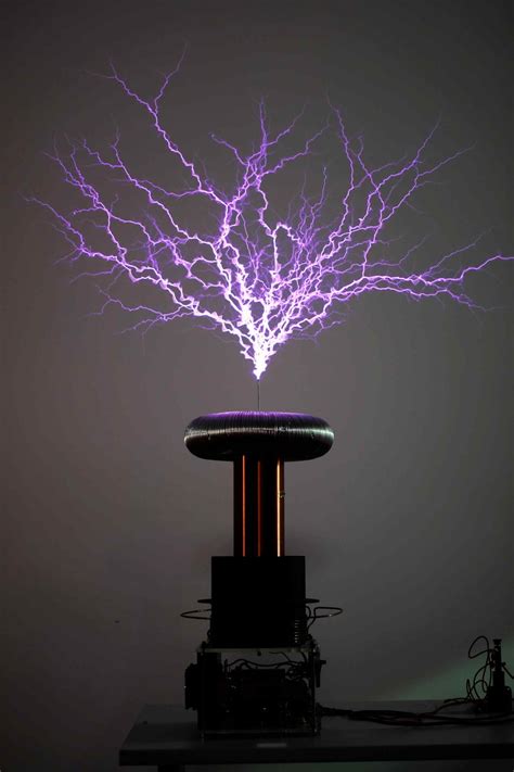 Tesla experimented with a number of different configurations consisting of two, or sometimes three, coupled resonant electric circuits. Tesla coil during discharge. | Download Scientific Diagram