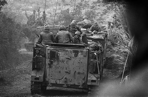 Soldiers Of The Americal Division Ride On Armoured Personnel Carriers