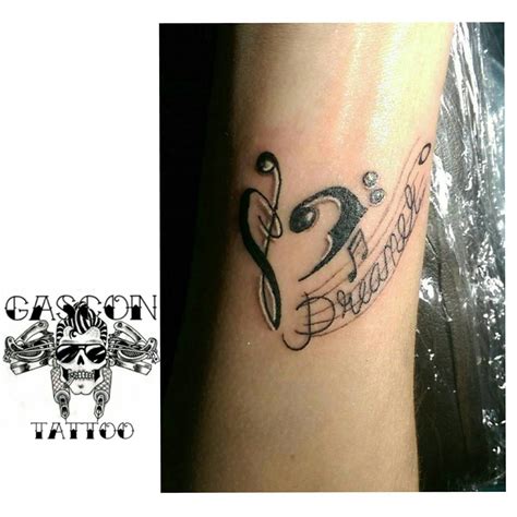 Treble clef heart ankle tattoo for girls. 60 Creative Music Tattoo Design Ideas For Music Lovers