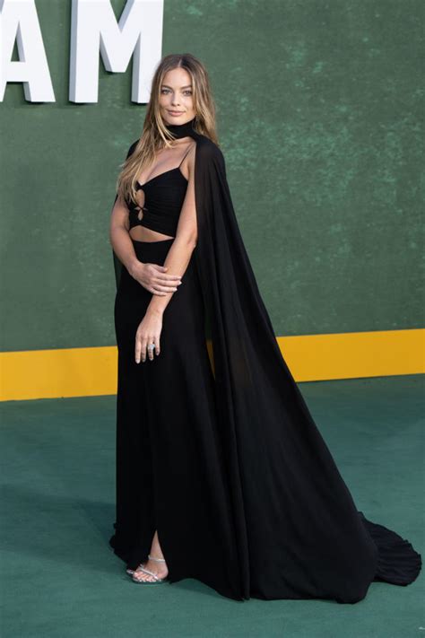 Margot Robbie Stuns In Caped Gown On Amsterdam Red Carpet