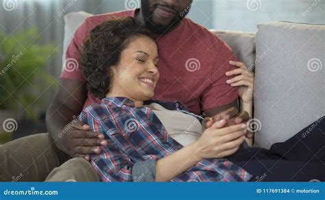 Biracial Girl Gently Stroking Man And Laughing At His Jokes Lying On His Lap Stock Footage