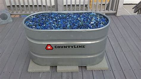 Propane is also more convenient than wood, generally cheaper, and most gas fire pits also include lava rocks, which provide a more realistic flame effect. Stock Tank Fire Pit | Diy gas fire pit, Stock tank, Wood ...