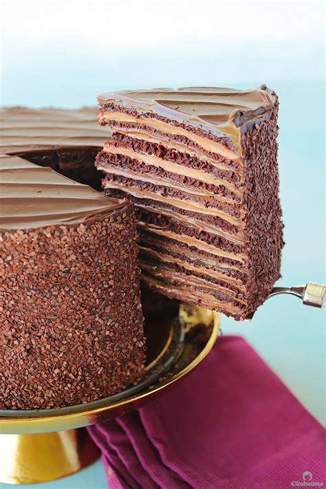 The key to baking flat layer cakes? Twelve layers of chocolate cake filled with alternating ...