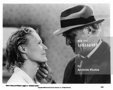 Glenn Close Has Her Chin Touched By Robert Loggia In A Scene From The