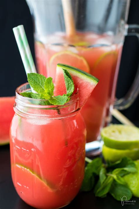 Two mason jars filled with watermelon lime and mint garnishes