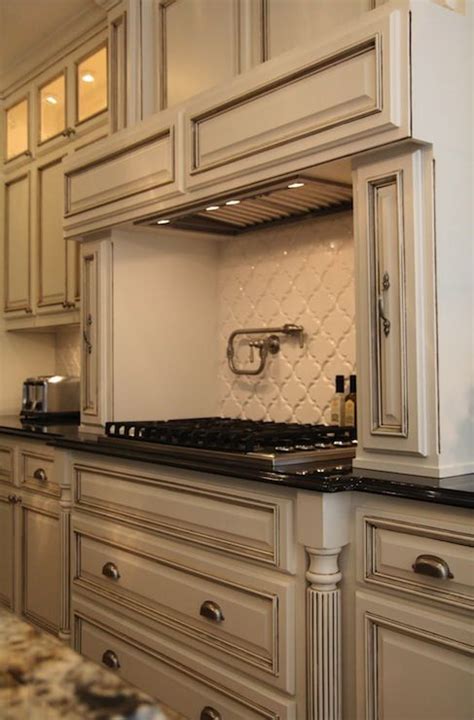 Then, apply glaze with a brush to a small. Suzie: M. E. Beck Design - Antique ivory kitchen cabinets ...