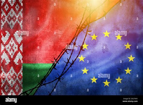 Grunge Flags Of Belarus And European Union Divided By Barb Wire With