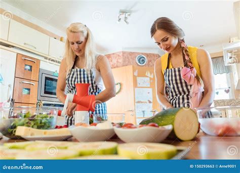 Two Women Making Salads In The Kitchen Stock Image Image Of Salads