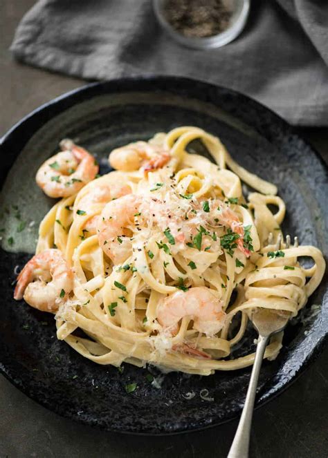This creamy pasta dish is a wonderful mixture of colorful vegetables and a simple lemon parmesan cream sauce. Creamy Garlic Prawn Pasta | RecipeTin Eats