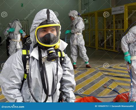 Emergency Team Wearing Chemical Protection Suit For Work In Dang