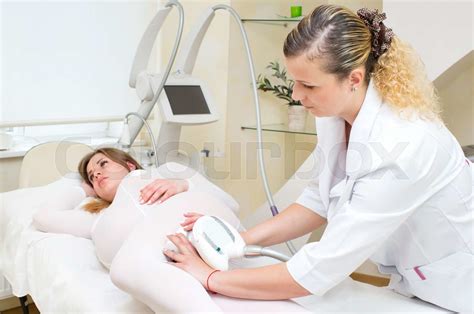 processes salon doing massage to a pregnant woman stock image colourbox