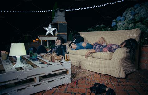 Young Drunk Friends Sleeping In Sofa High Quality People Images