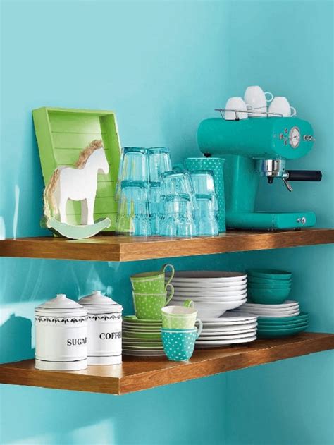 White kitchen cabinets with teal island grey quartz countertops. Turquoise Kitchen Designing - Interior Design Blogs