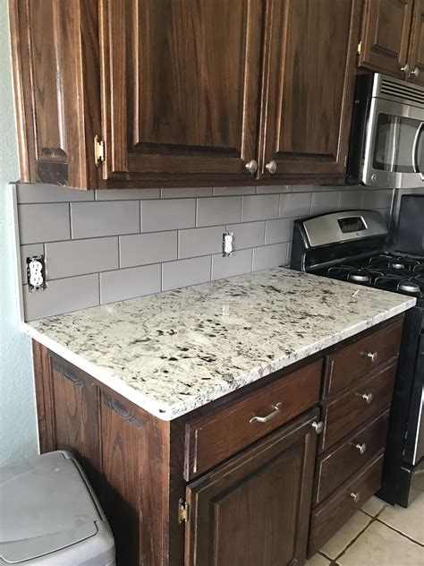 Taupe Backsplash And White Galaxy Granite Small Cottage Kitchen