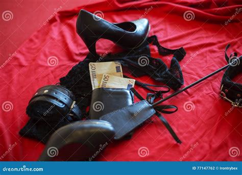 Prostitute Or Striptease Concept 50 Euro Banknot With Sex Toys On Red