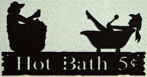 a metal sign that says hot bath 5 cents