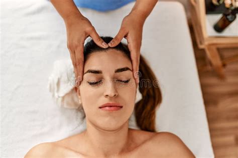 Two Women Therapist And Patient Having Facial Massage Session At Beauty Center Stock Image