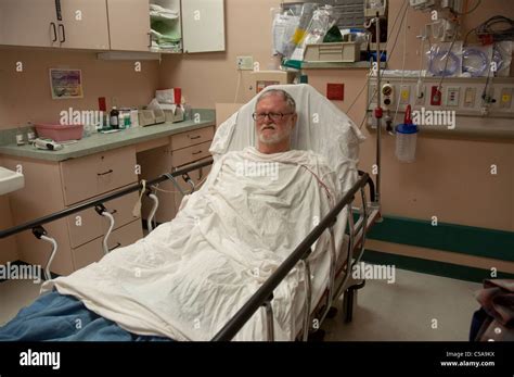 Man Lying In Hospital Bed In The Emergency Room Stock Photo Alamy