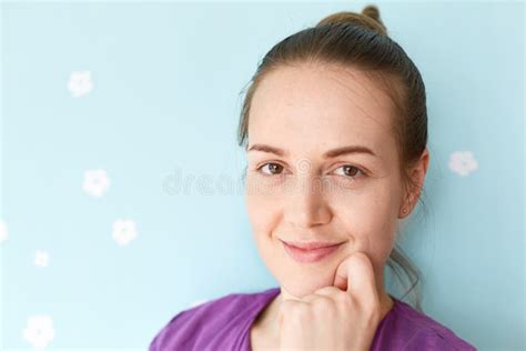 Headshot Of Pleasant Looking Charming Smiling Young Woman With Healthy