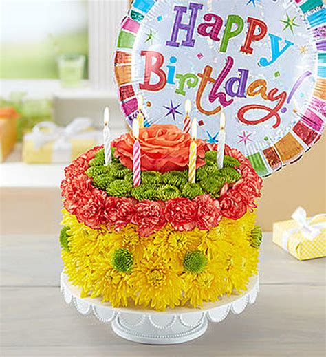 Hand arranged and delivered by one of our local florist in a clear fluted vase with a colorful curly ribbon and a birthday mylar balloon. Birthday Wishes Flower Cake™ Yellow - Conroy's Flowers