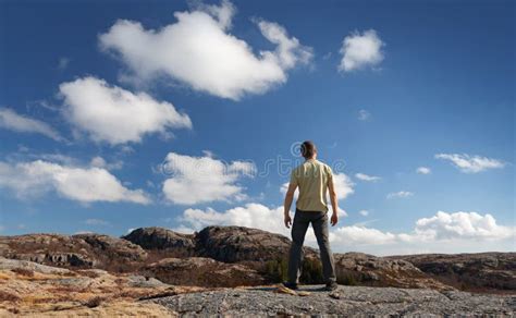 Young Man Stands On Rocky Ground Stock Photo Image Of Blue Freedom