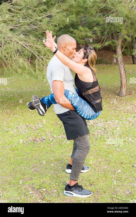 Fitness Couple Doing Abdominal And Kissing Each Other Stock Photo Alamy