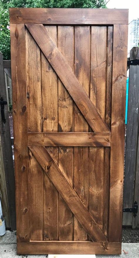 Supplies (this post contains affiliate links). Farmhouse Barn door | Diy barn door, Rustic wood doors ...