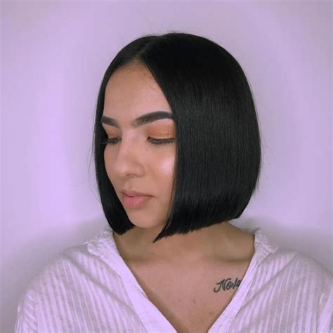 A blunt haircut is any cut that is one length. Sleek Blunt Bob with Center Part and Black Color - The ...