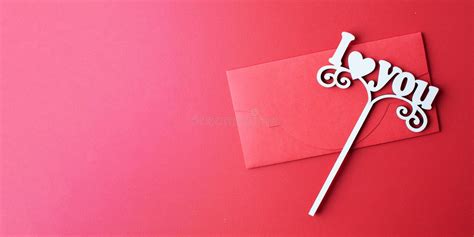 Flat Lay Envelope And A Sign With The Words I Love You On A Red Background The Concept Of