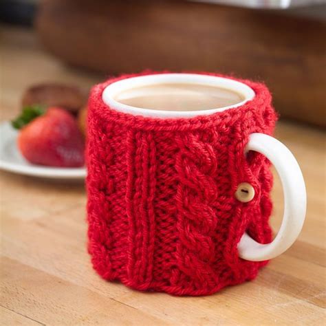 The top has impressive swirl shaping to top off this gorgeous project. Cable knit cozy | Crochet mug cozy, Tea cosy knitting ...