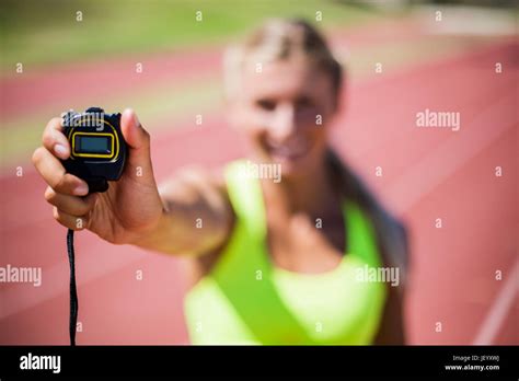 Female Athlete Showing Stop Watch Stock Photo Alamy