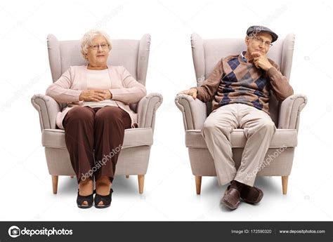 Elderly Man And Woman Sitting In Armchairs Stock Photo By