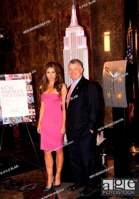elizabeth hurley lights the empire state building pink to kick off the 2015 estee lauder breast