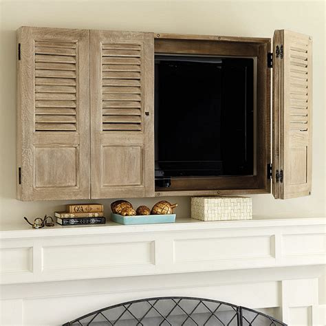 Furthermore, this tv wall cabinet also hides the unsightly cable clutter that a simple mounting can never manage to do. Shutter TV Wall Cabinet | Ballard Designs