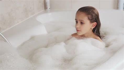Little Girl Bathes Bathtub Plays Foam Hygiene Baby Care Concept Stock