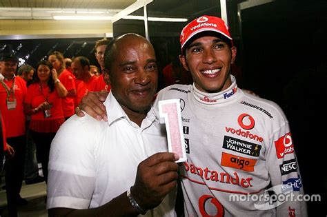 Lewis hamilton biography,family,parents,hair style,beard style,affairs, girlfriend,body,tattoo,fashion,childhood,house,net worth,salary,car collection,yacht. Lewis Hamilton Parents Photos