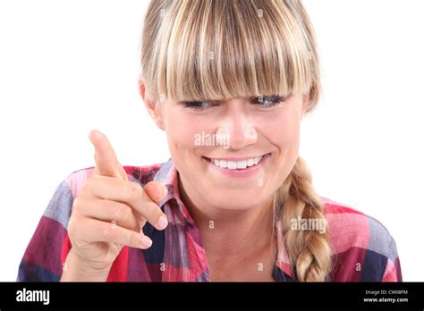 Young Woman Wagging Her Finger In A Lighthearted Manner Stock Photo Alamy