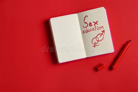 Notebook With Phrase `sex Education` On Red Background Flat Lay Stock