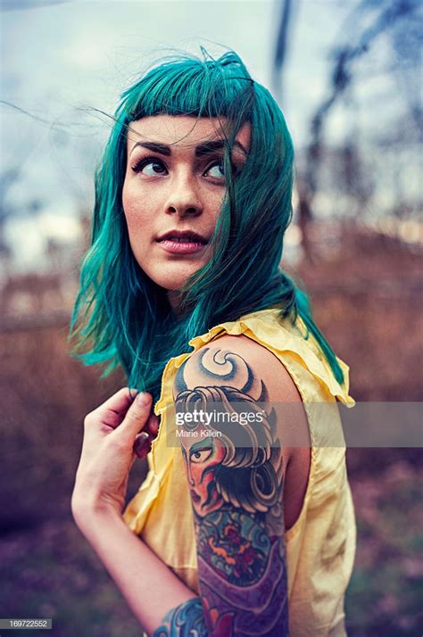 Girl With Blue Hair And Tattoos Looking Over High Res