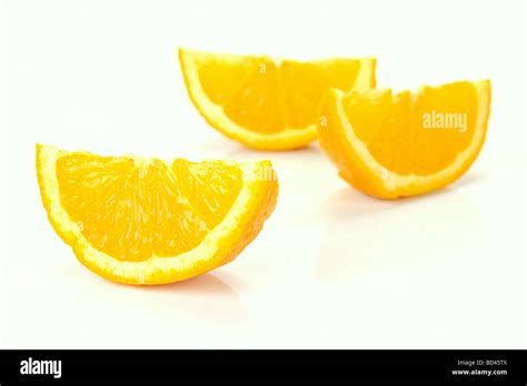 Fresh Orange Halves Isolated Against A White Background Stock Photo Alamy