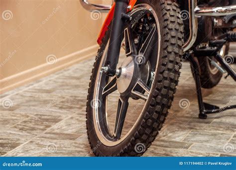 Front Wheel Of A New Clean Shiny Motorcycle In A Room Stock Photo