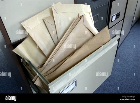 Over Filled Office Filing Cabinet Stock Photo Alamy