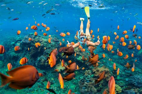 Girl In Snorkeling Mask Dive Underwater With Coral Reef Fishes Stock