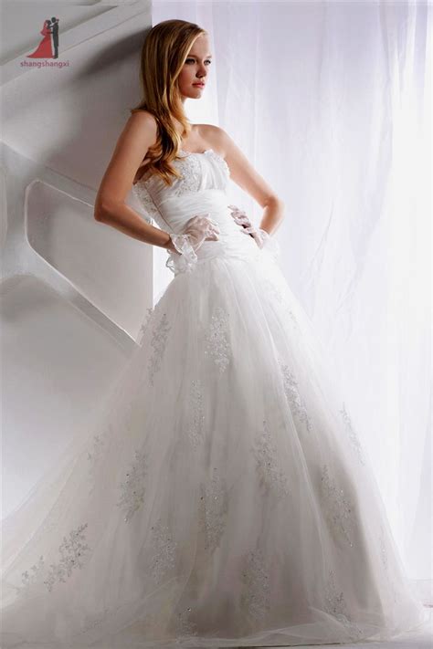 Bride in wedding ring holding glass of champagne in hand. >> Click to Buy