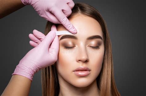 Makeup Artist Does Facial Hair Removal Procedure Beautiful Girl Having