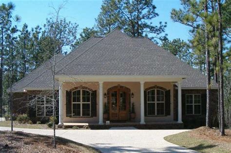 Brick exterior, front porches, and wraparound porches are also typical of this architectural design. Acadian Style House Plans With Front Porch