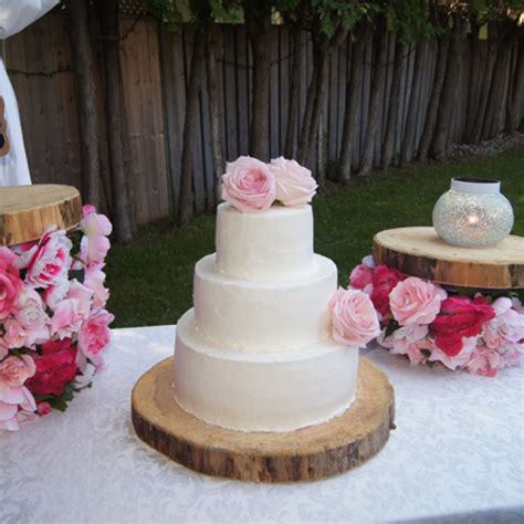 3 tier buttercream rustic garden wedding cake with fresh pink roses
