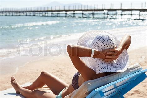 Beautiful Woman Sunbathing On A Beach Stock Image Colourbox