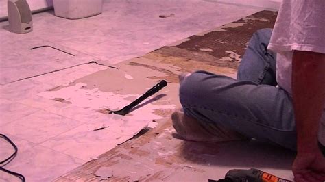 Learning how to remove vinyl floor tiles from concrete helps you tackle the task without calling an expensive tile. removing vinyl flooring from wood - YouTube