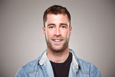 Portrait Of A Normal Man Smiling Over Grey Background Stock Photo